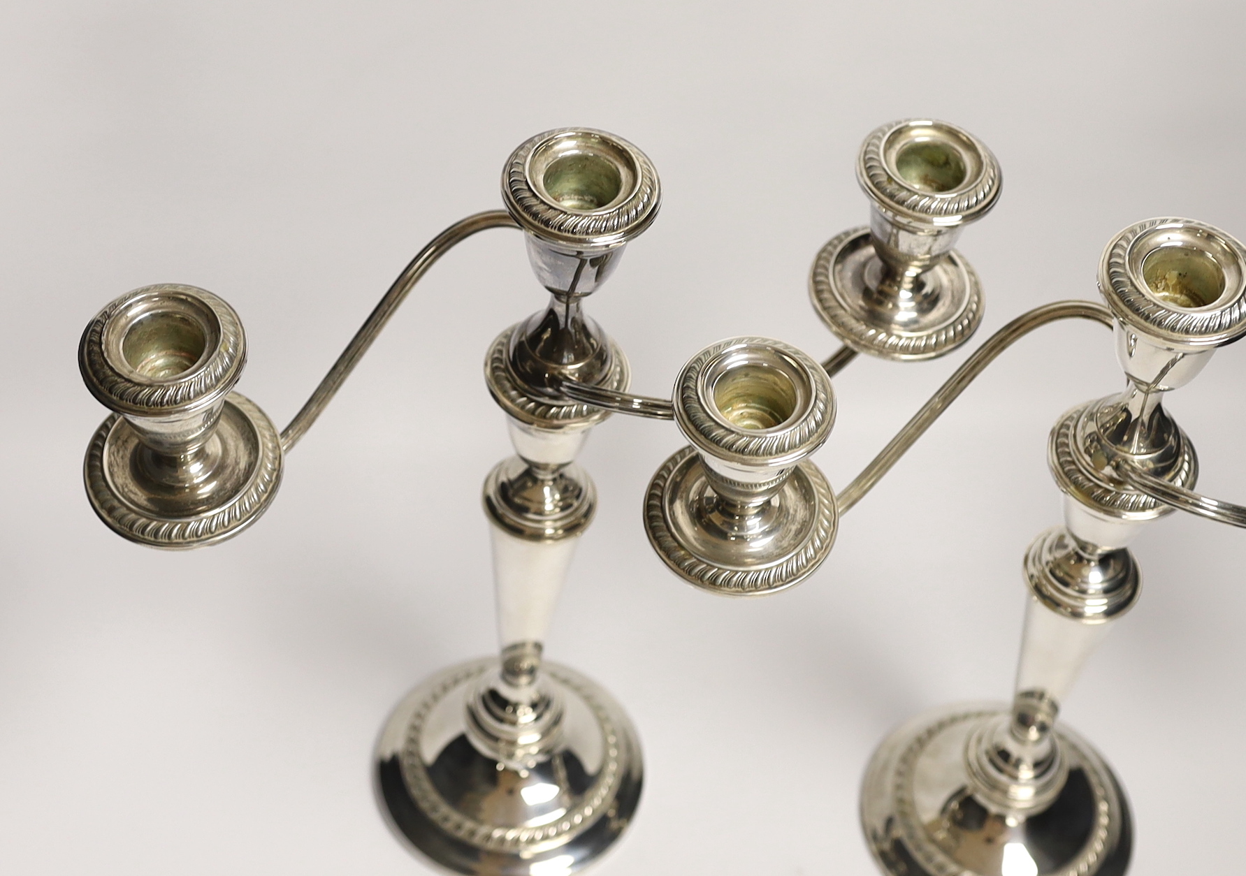 A pair of 20th century Alvin sterling three light, two branch candelabra, height 32.1cm, weighted